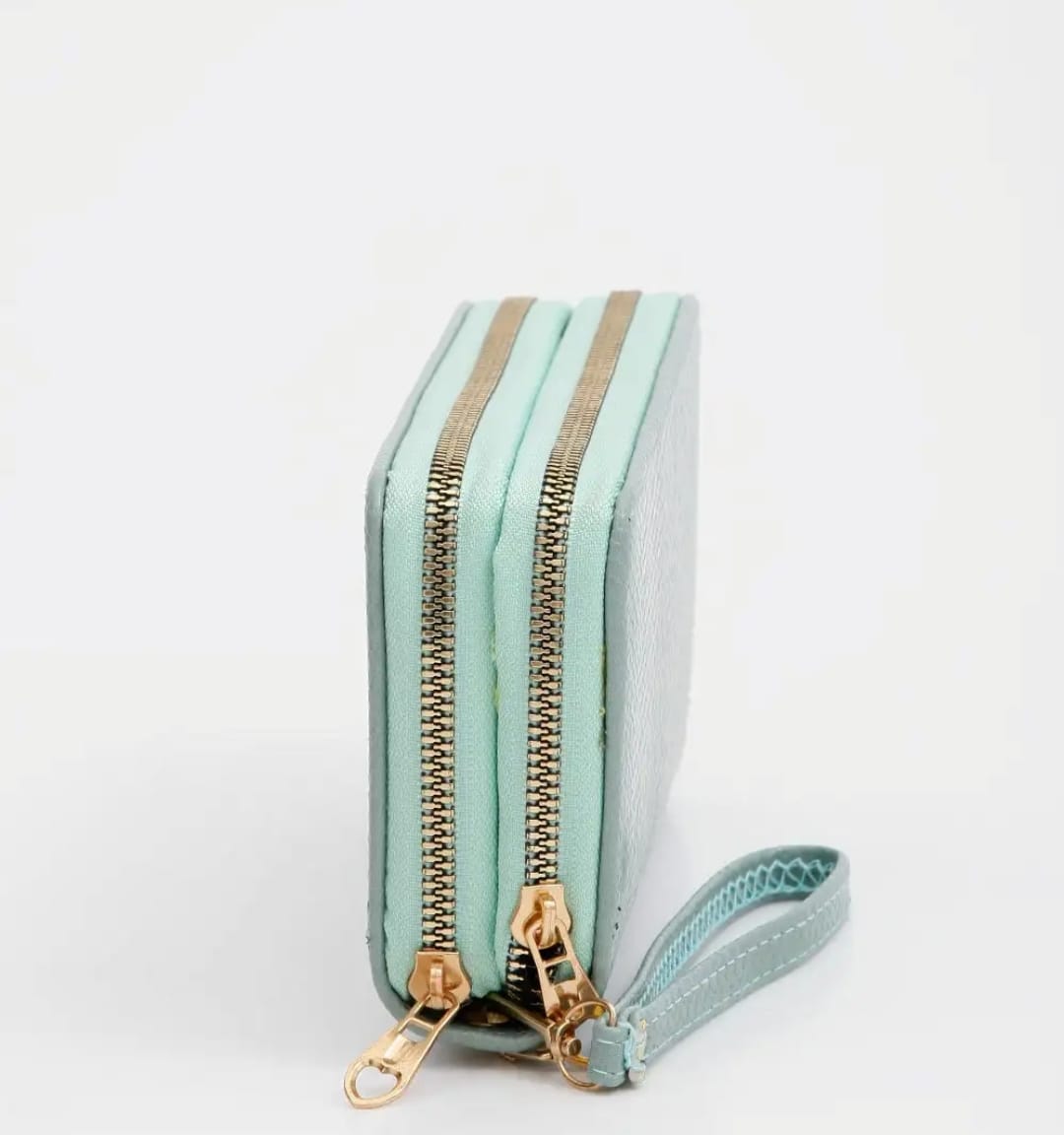 "Forever Young Women’s Long Clutch in Black, Red, Green, Pink, and Blue. The clutch features a sleek, stylish design with a spacious interior and a built-in cardholder, ideal for organizing essentials and adding elegance to any outfit."