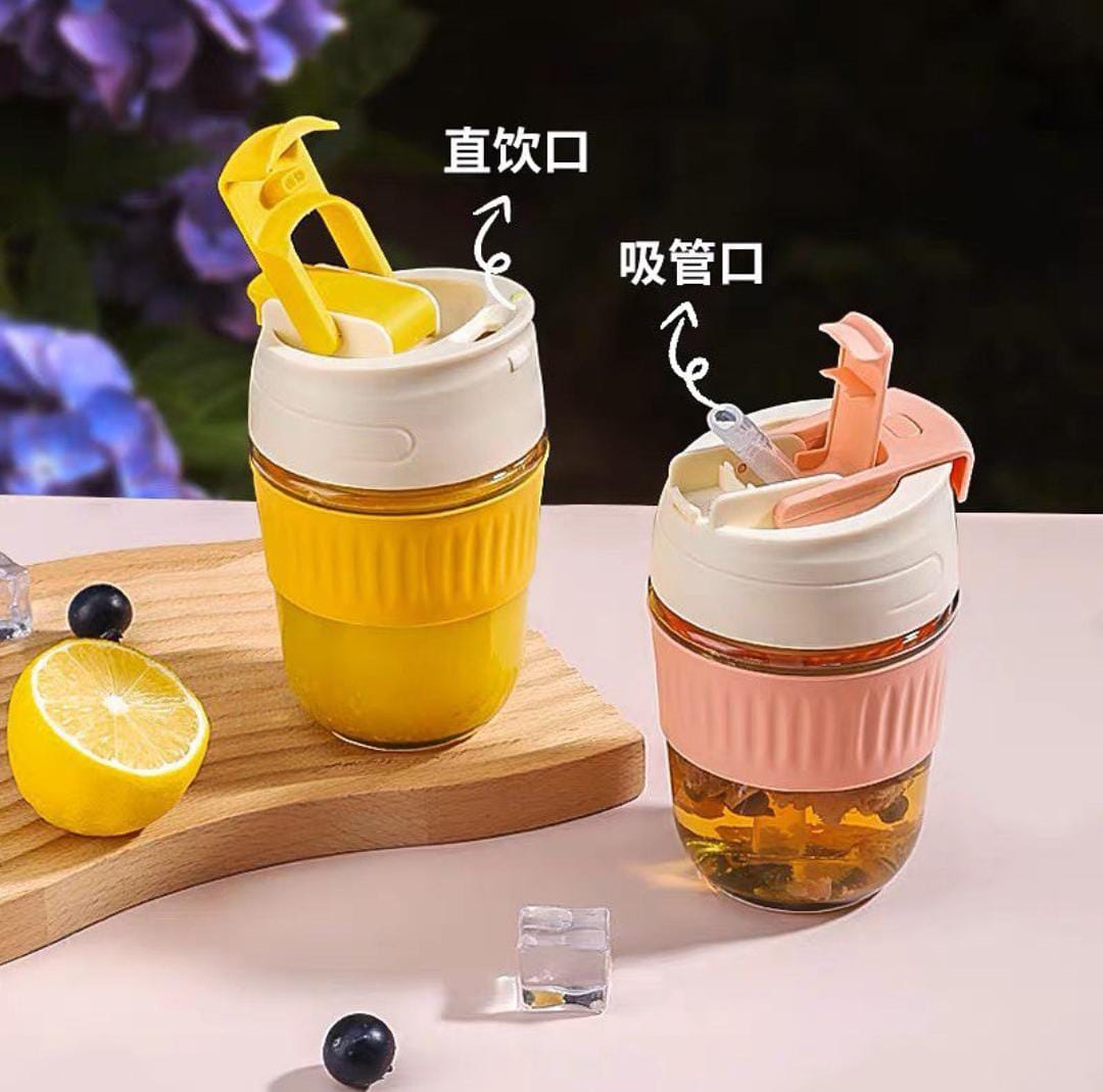 "Portable glass mug with built-in straw, perfect for sipping coffee, tea, and juice on-the-go."