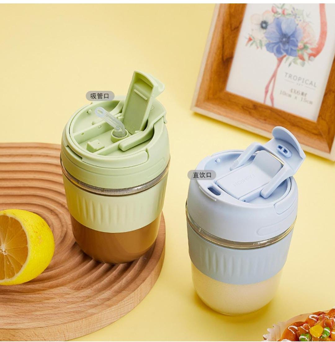 "Portable glass mug with built-in straw, perfect for sipping coffee, tea, and juice on-the-go."