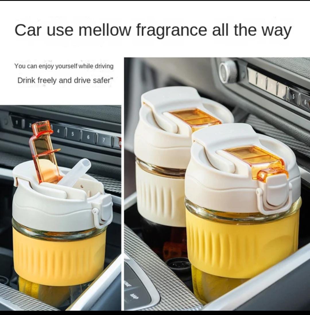 "Portable glass mug with built-in straw, perfect for sipping coffee, tea, and juice on-the-go."